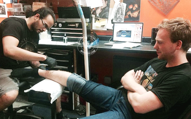Tattoo on leg criticizing southern trains