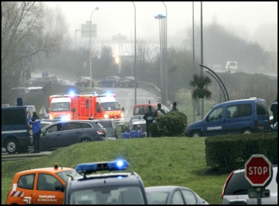 Charlie Hebdo attackers surrounded