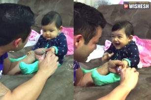 Baby fake cry, while dad tries to cut nails