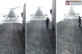 convoy driver, pilot, kazakhstan helicopter lands on the road pilot gets down to ask direction, Helicopter