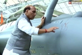 Rajnath Singh in France, Rajnath Singh latest, rajnath singh receives the first rafale fighter jet, Rajnath singh
