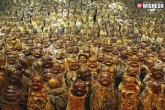 weird news, Buddha statues, chinese man carves 9 200 buddha statues from dead trees, Chinese man