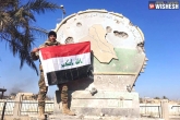 Ramadi, Iraq Military flies flag on Ramadi, iraqi military flies national flag above ramadi, National flag