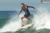 viral videos, girl surfing with high heels, omg girl is surfing with high heels, Omg